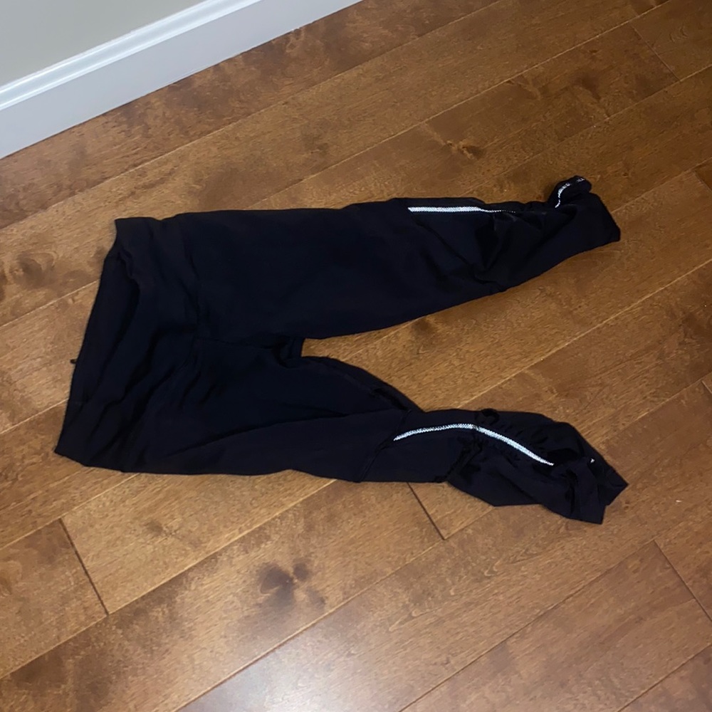 Lululemon running tight. Capri size 4 with rear pocket.